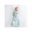 Kyte Baby Original Bamboo Sleep Bag in sage, with a sleeping baby inside, displayed against a white background.