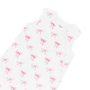 Kyte Baby Sleep Bag in Bow 1.0 Tog, featuring a white fabric with pink bow patterns and a side zipper for easy dressing.