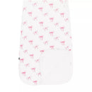 Kyte Baby Sleep Bag in Bow 1.0 Tog, featuring a white background with pink bow patterns and a side pocket.