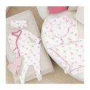 Women’s short sleeve pajama set and a matching baby outfit, featuring white fabric with pink bow patterns.