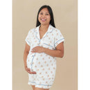 Kyte Baby Women’s Short Sleeve Pajama Set in Teddy Bear print, featuring a pregnant model smiling and holding her belly.