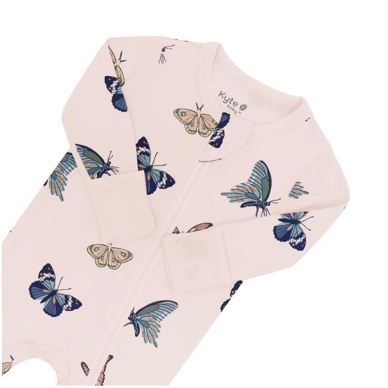 Zippered footie in blush color with a butterfly print, featuring long sleeves and a snug fit, designed for infants.