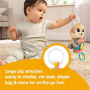 Baby playing with Lamaze - Arty Says Cheese toy, featuring a colorful plush design and large clip for easy attachment.