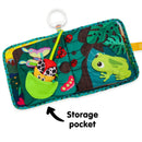Soft fabric book featuring colorful illustrations of insects and a frog, with a storage pocket containing a toy.