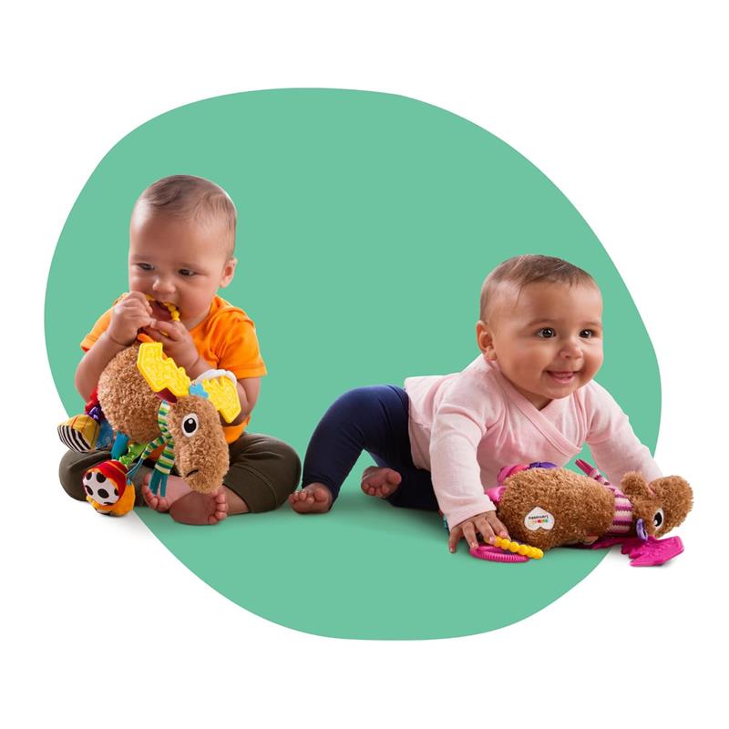 Two babies interact with the Lamaze Muffin the Moose toy, featuring colorful textures and sounds.