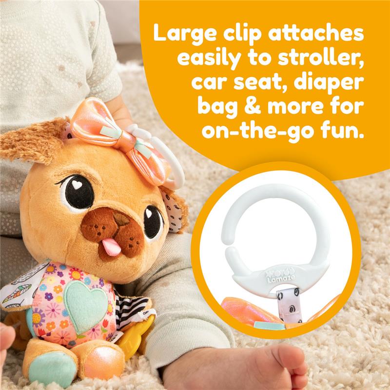 Colorful plush toy in the shape of a pug with a bow and large clip for easy attachment to strollers or bags.