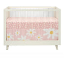 3-piece bedding set featuring pink fabric with white daisies and a cheerful design, ideal for nursery decor.