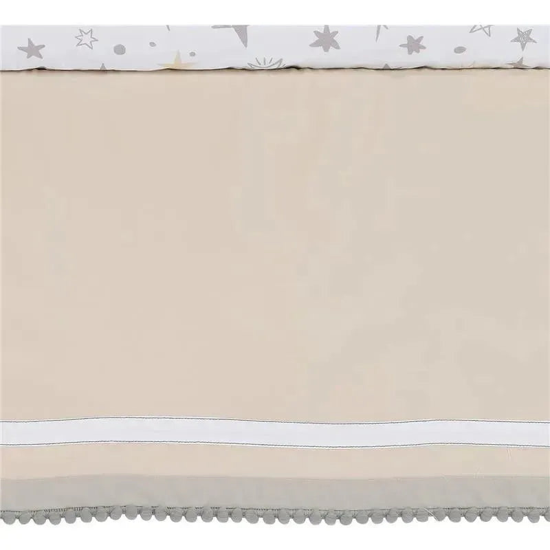 Lambs & Ivy Goodnight Moon baby crib bedding set features soft beige fabric with a celestial-patterned top and decorative gray pom-poms.