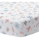 Watercolor floral design featuring pink and blue flowers and butterflies on a fitted crib sheet.