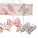 Pink and gray felt butterflies hang from a soft pink fabric frame, designed as a musical crib mobile for babies.