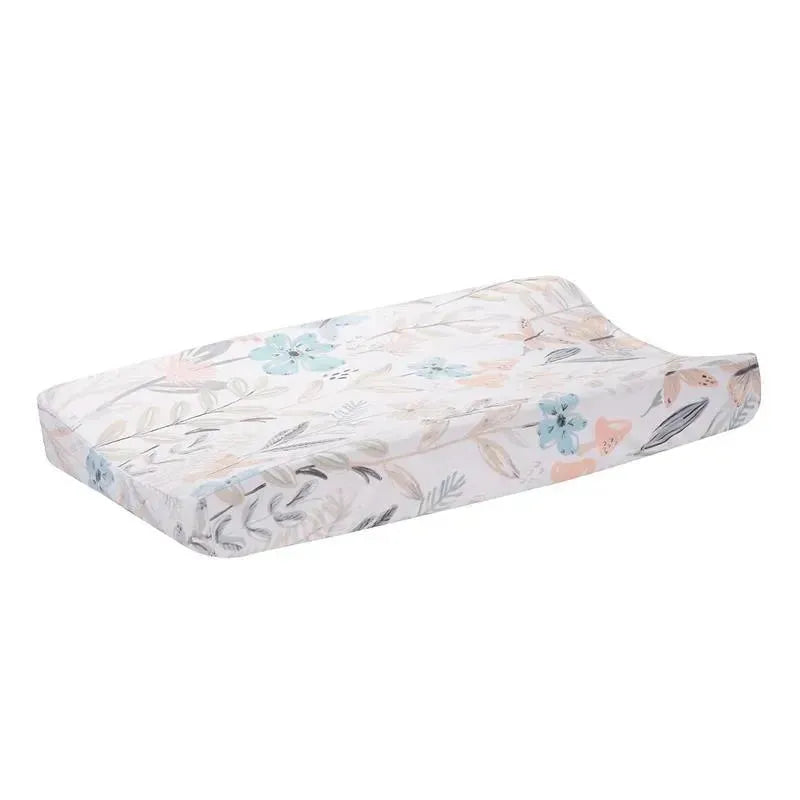 Soft changing pad cover featuring watercolor floral and butterfly design in pastel colors.