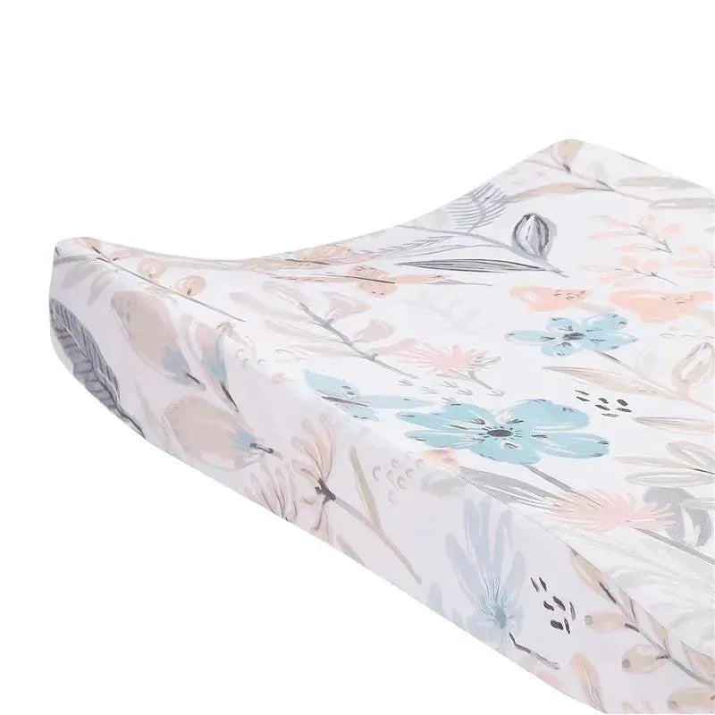 Soft changing pad cover featuring a watercolor floral and butterfly design in pastel colors.