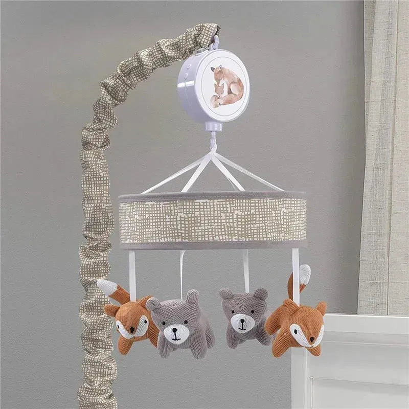 Baby crib musical mobile featuring a neutral-toned circular design with plush forest animal figures hanging below.