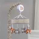 Baby crib musical mobile featuring a neutral-toned circular design with plush forest animal figures hanging below.