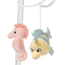 Soft plush sea-themed toys featuring a pink seahorse and a yellow fish, designed for a musical baby crib mobile.