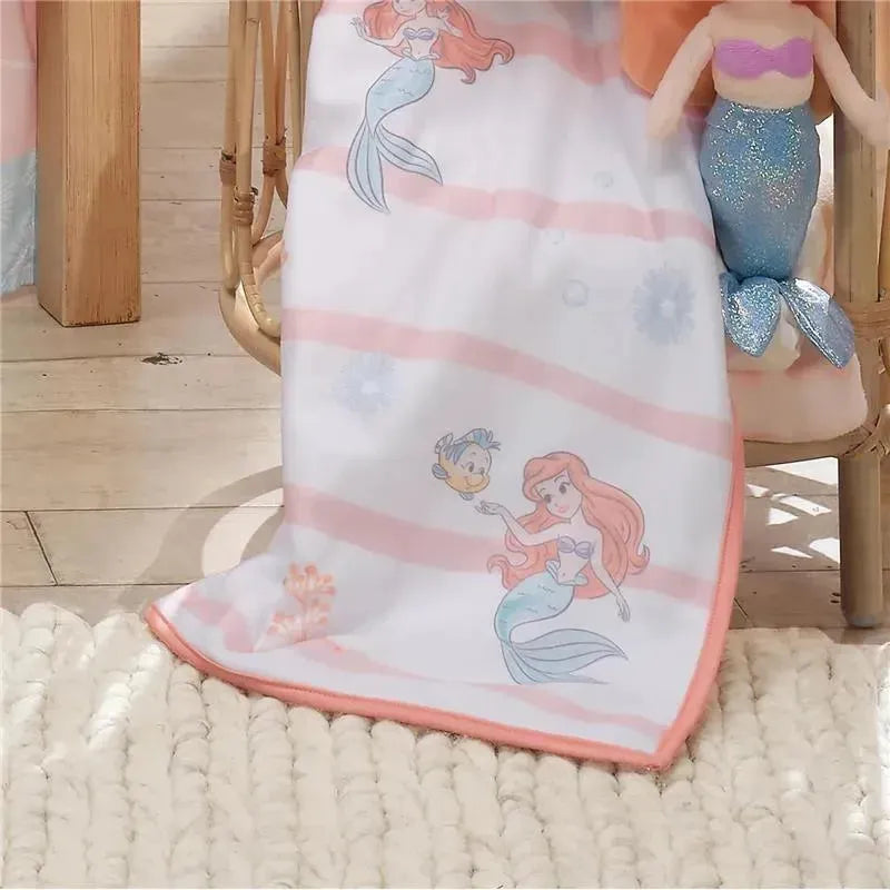White baby blanket featuring Ariel from The Little Mermaid, with pink stripes and ocean motifs. Ideal for infants.