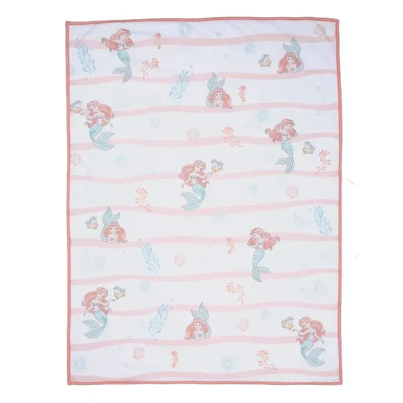 White baby blanket featuring Ariel from Disney’s The Little Mermaid, with pink stripes and underwater motifs.