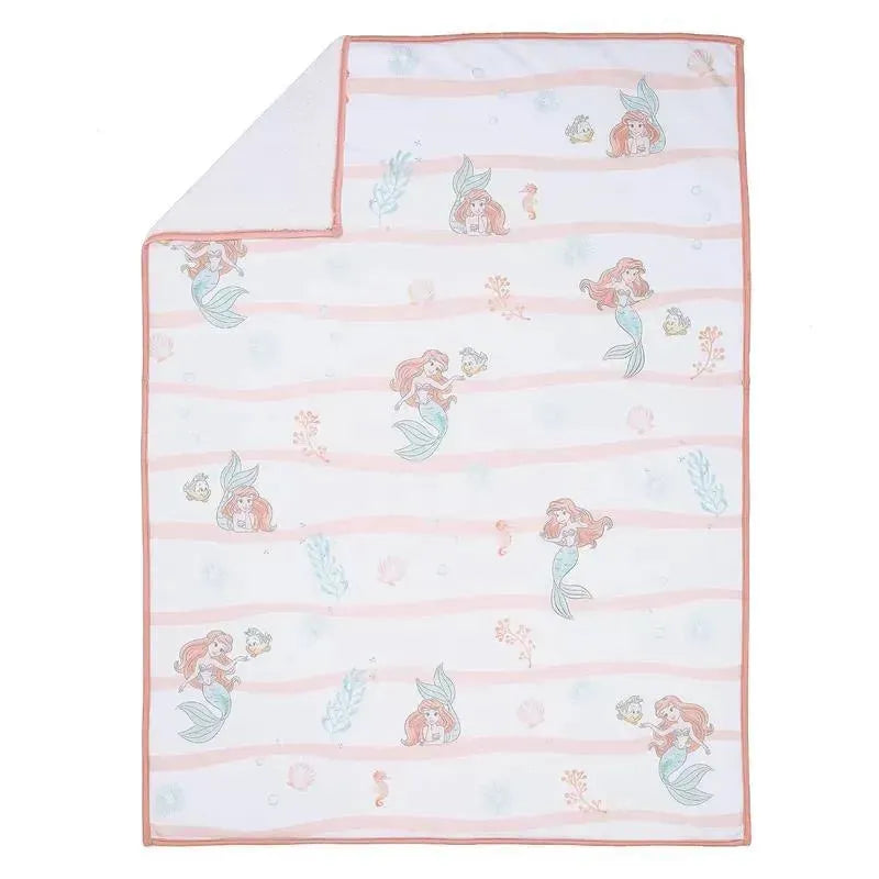 White baby blanket featuring Ariel and underwater motifs, with a pink striped border and soft fabric.