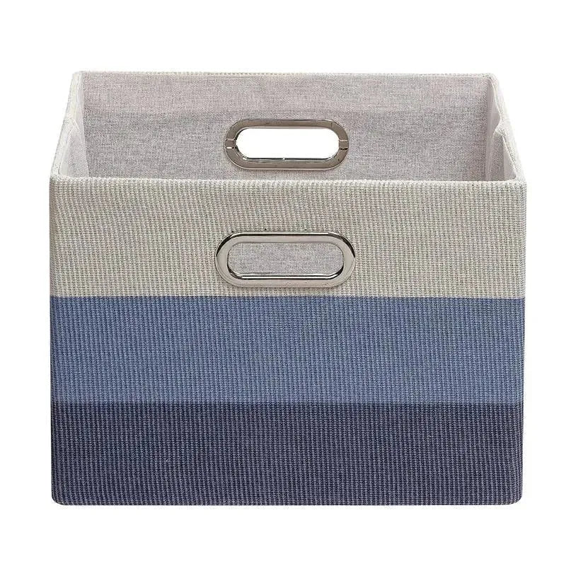 Foldable storage container in blue ombre design, featuring metal handles for easy carrying and organization.