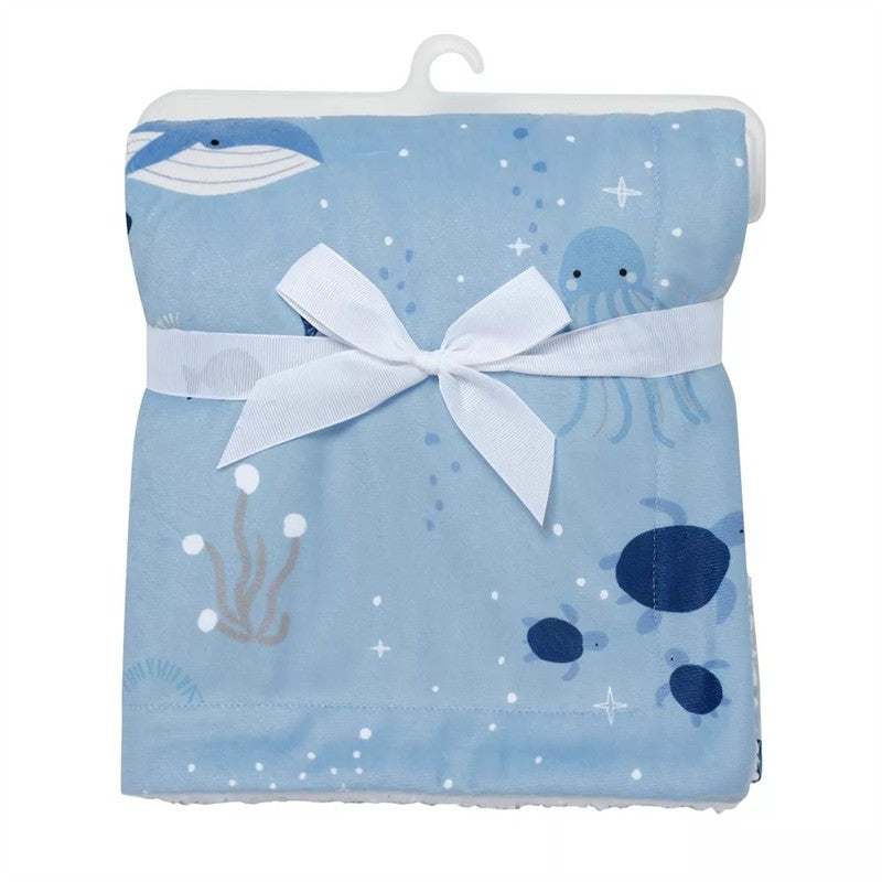 Lambs & Ivy Bubble & Squirt Baby Blanket featuring a blue ocean-themed design with jellyfish, turtles, and a decorative bow.