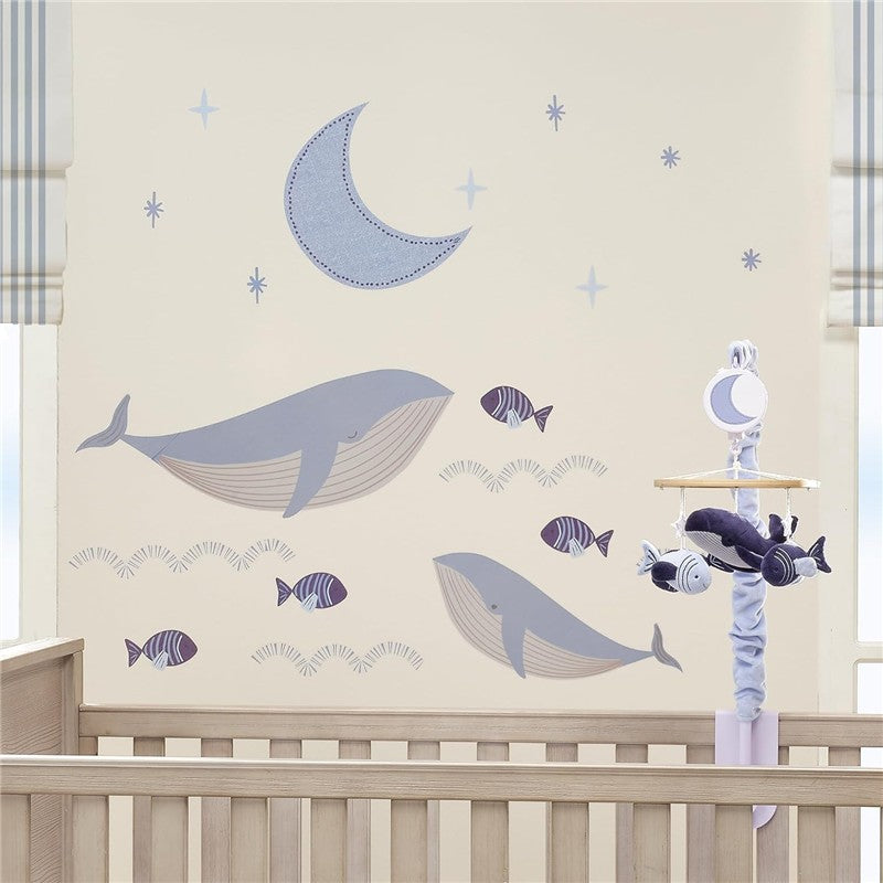Lambs & Ivy Bubble & Squirt Wall Decals featuring gray whales, fish, and a moon design on a nursery wall.