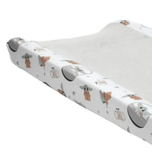 Changing pad cover featuring The Child (Baby Yoda) illustrations with pastel colors and star motifs.