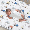 Lambs & Ivy Construction Zone baby fitted crib sheet featuring colorful construction vehicle patterns with a sleeping infant.