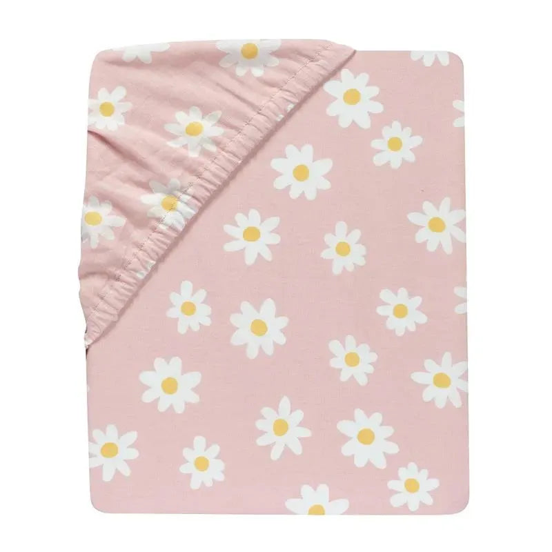 Light pink fitted crib sheet adorned with white daisies, designed for nursery use by Lambs & Ivy.