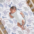 Fitted crib sheet featuring colorful dinosaur patterns with a sleeping baby in a white onesie.