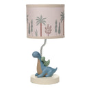 3D dinosaur nursery lamp featuring a blue dinosaur with a green baby dinosaur on its back, topped with a patterned shade.