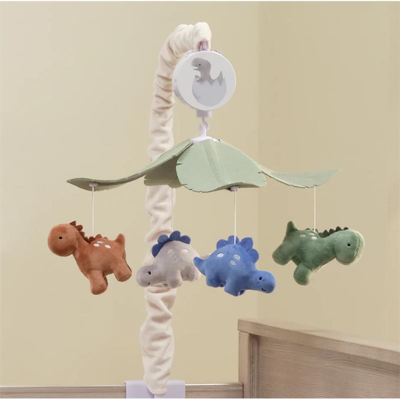 Dino Might musical mobile featuring plush dinosaurs in brown, gray, blue, and green hanging from a leaf canopy. Plays 20 minutes of music.