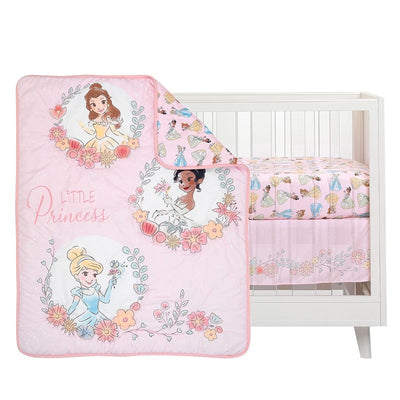 Disney Princesses nursery crib bedding set featuring a quilt with Cinderella, Belle, and Tiana on a pink background.