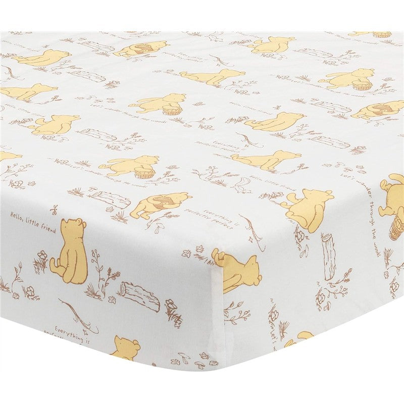 Lambs & Ivy Disney Storytime Pooh crib sheet featuring playful illustrations of Winnie the Pooh and nature elements.