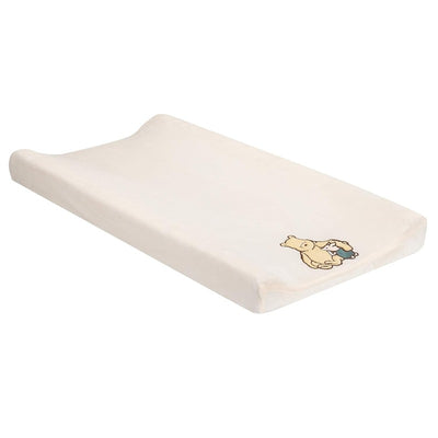 Changing pad cover featuring a light beige design with a classic Winnie the Pooh illustration.