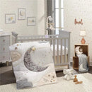 Plush quilt featuring a moon design with metallic stars and a quote, set in a soft, star-themed nursery.
