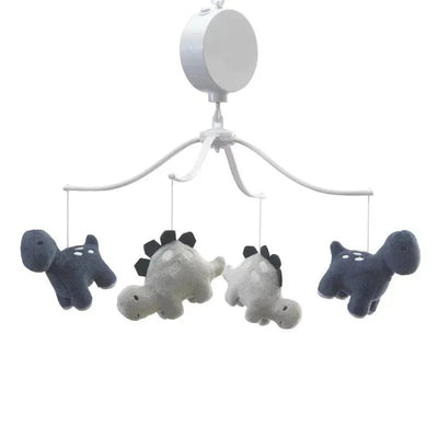 Musical mobile featuring plush dinosaur figures in gray and navy, suspended from a white overhead frame.