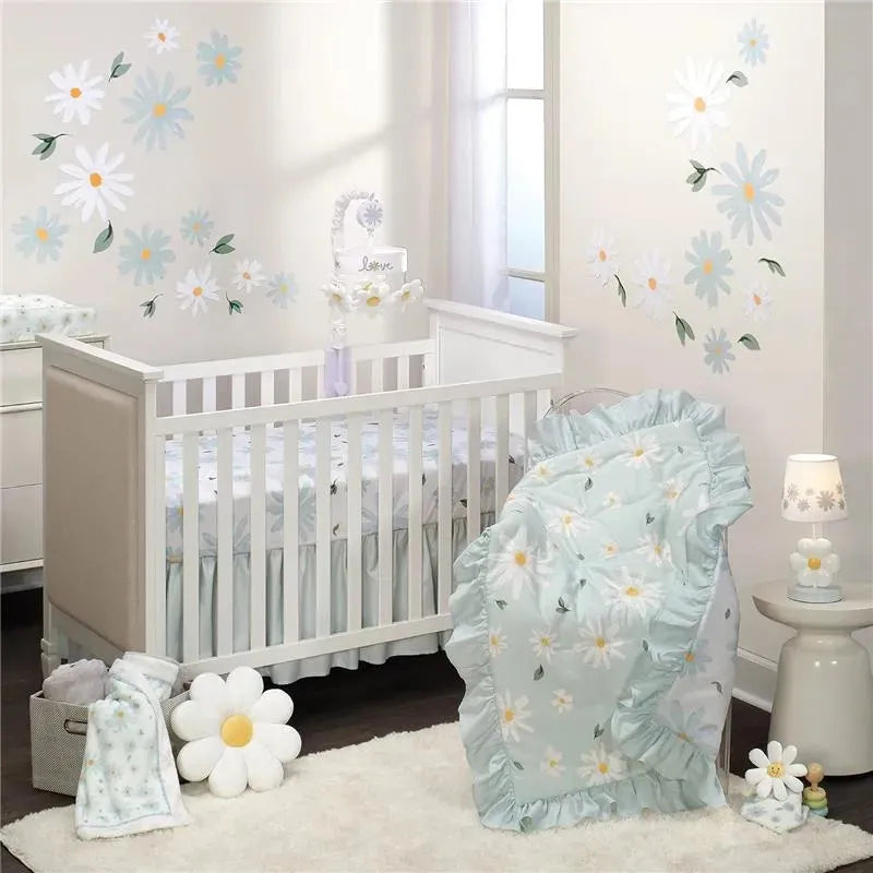 Security blanket from Lambs & Ivy in soft mint green, adorned with daisies, draped over a crib in a decorated nursery.