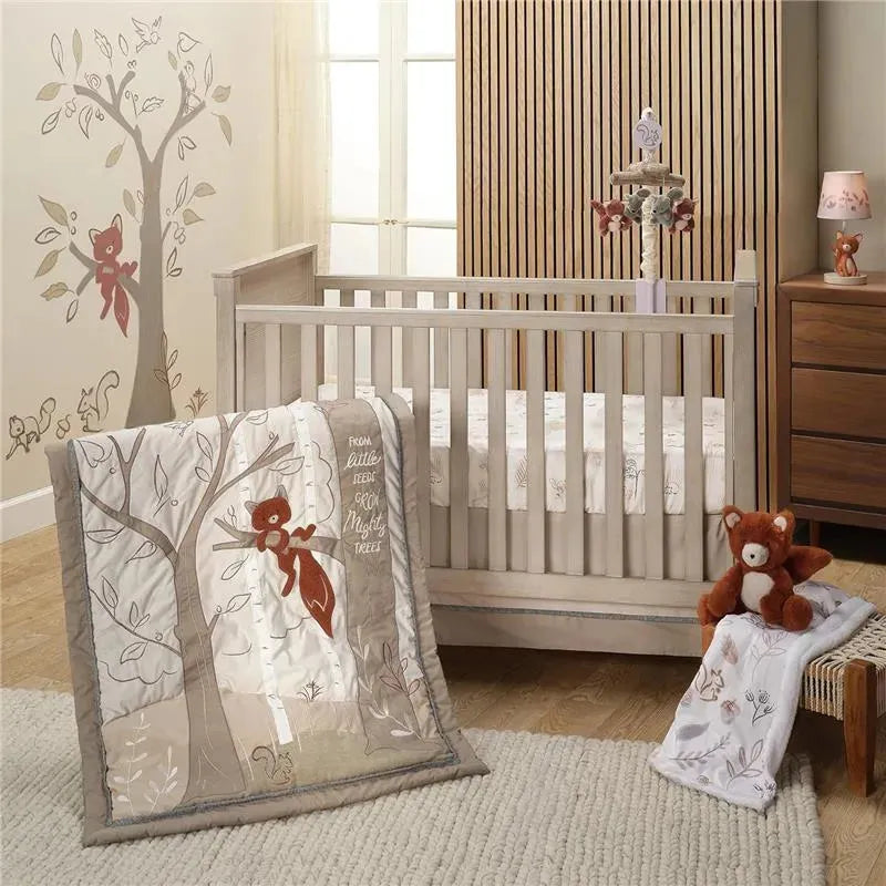 Lambs & Ivy Treetop Fox Musical Mobile above a crib, featuring a fox-themed quilt, stuffed animal, and nature-themed decor.