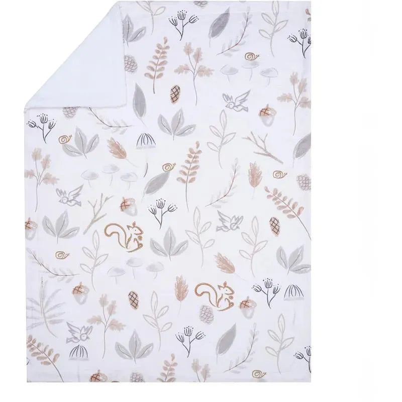 Woodland-themed blanket featuring illustrations of a squirrel, leaves, and flowers in soft, neutral colors.