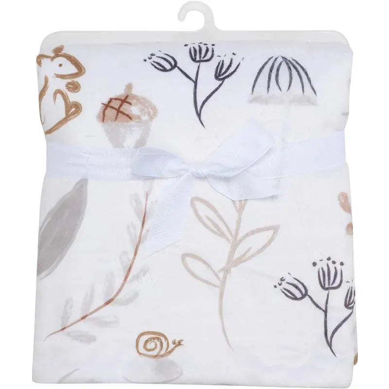 Woodland blanket featuring playful animal and plant designs, tied with a white ribbon. Perfect for baby nurseries.