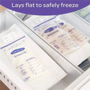 Lansinoh breast milk storage bags laid flat in a freezer, labeled with measurement markings for easy tracking.