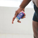 Lansinoh Herbal Post-Birth Relief Spray held in a hand, designed for post-birth comfort and relief.
