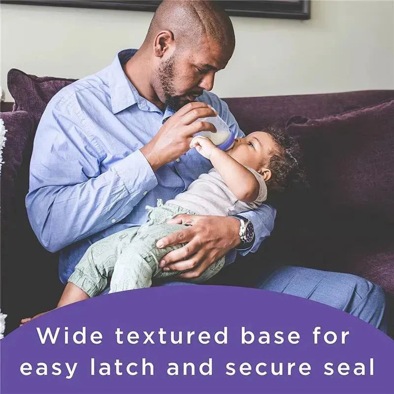 Lansinoh silicone baby bottle nipples, featuring a wide textured base for easy latch and secure seal, being used by a father with his child.