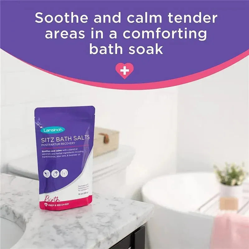 Lansinoh Sitz Bath Salts for postpartum recovery, 10oz pouch on a marble surface with soothing text above.