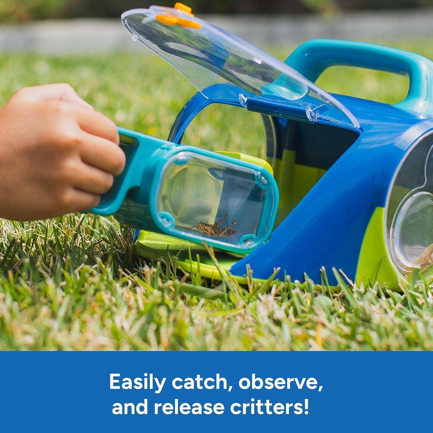 Learning Resources Geosafari Bugservatory with hand-held bug catcher, capturing a critter in grass.