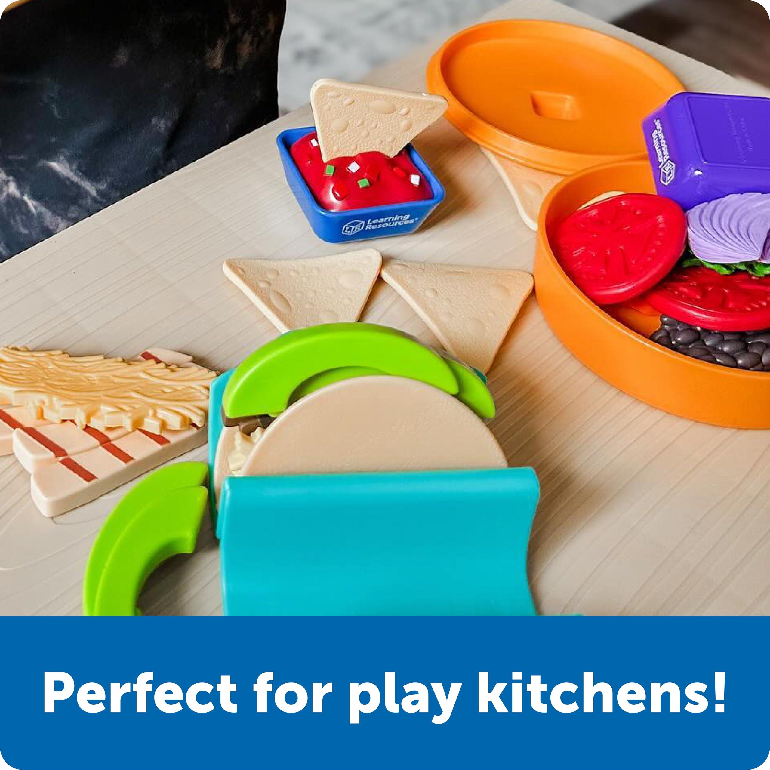 Colorful toy food items including tacos, tortillas, and toppings, ideal for imaginative play and play kitchens.