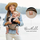 Líllébaby Elevate 6-In-1 Linen Blend Baby Carrier in Warm Sand, featuring a smiling woman holding a baby.