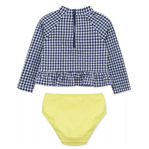 Gingham rashguard swim set for baby girls, featuring a long-sleeve navy and white checkered top with a ruffled hem and a yellow bikini bottom.