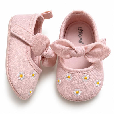 Pink baby girl shoes with a bow and daisy embroidery, designed by Little Me. Ideal for toddlers.