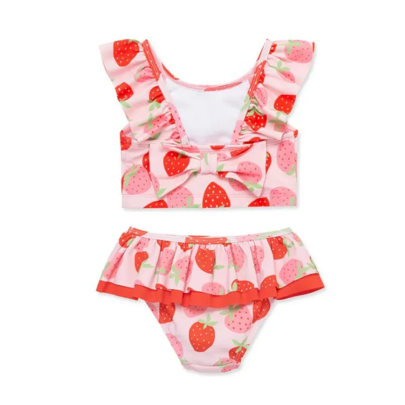Baby girl swimsuit with a strawberry print, featuring a ruffled top with a bow and a matching frilly bottom.